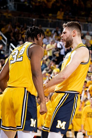 Tarris Reed Jr. (32) and Hunter Dickinson (1)