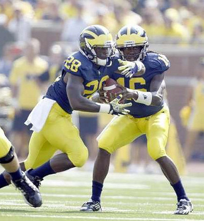 Fitzgerald Toussaint (28) and Denard Robinson (16)