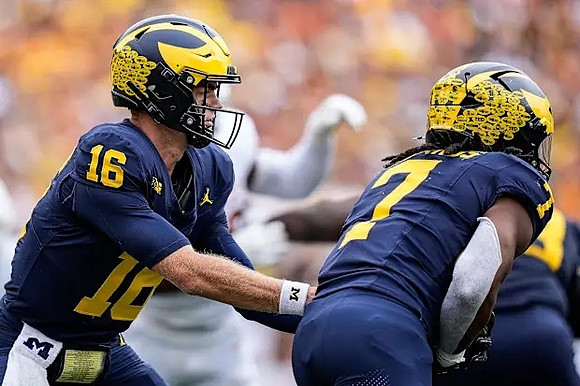 Davis Warren (16) and Donovan Edwards (7)