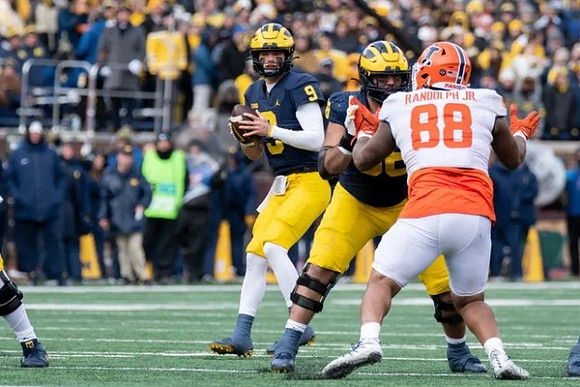 J.J. McCarthy (9) and Giovanni El-Hadi (58)