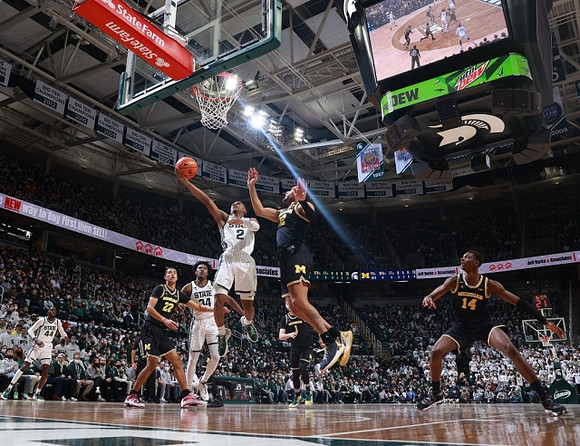 Caleb Houstan (22), DeVante' Jones (12), Hunter Dickinson (1), and Moussa Diabate (14)