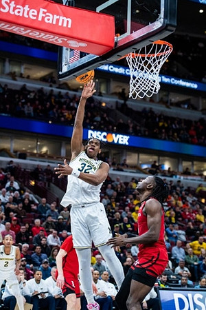 Kobe Bufkin (2) and Tarris Reed Jr. (32)