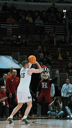 Joey Baker (15) and Rutger's Mascot