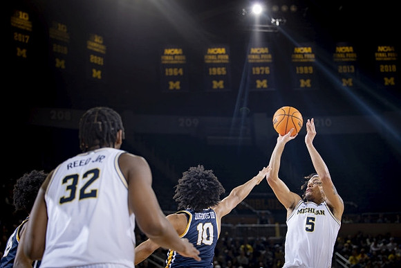 Tarris Reed Jr. (32) and Terrance Williams II (5)