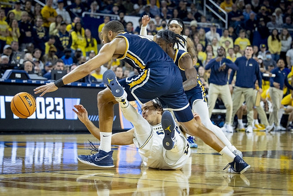 Terrance Williams II (5) and Dug McDaniel (0)