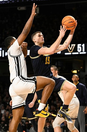 Joey Baker (15) and Juwan Howard