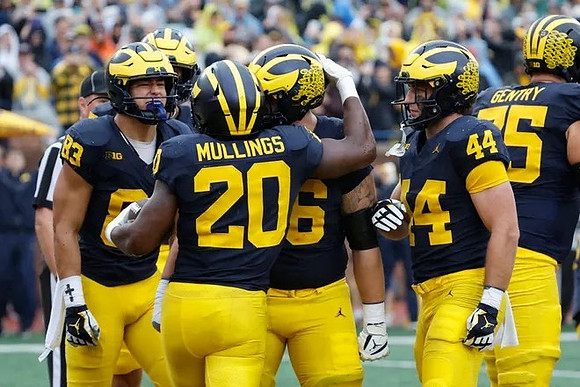 Zack Marshall (83), Kalel Mullings (20), Max Bredeson (44), and Andrew Gentry (75)