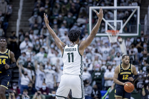 Moussa Diabate (14) and DeVante' Jones (12)