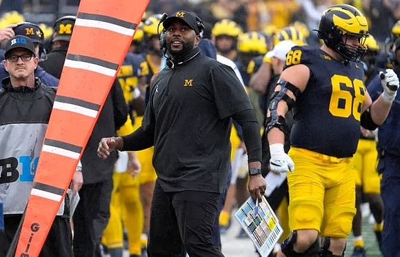 Sherrone Moore and Josh Priebe (68)
