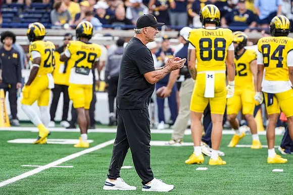 Kyle Whittingham and Michigan Team