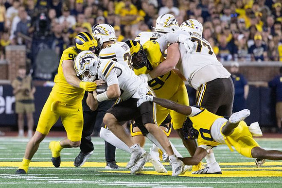 John Henry Daley (90), Trey Pierce (95), and Jyaire Hill (0)