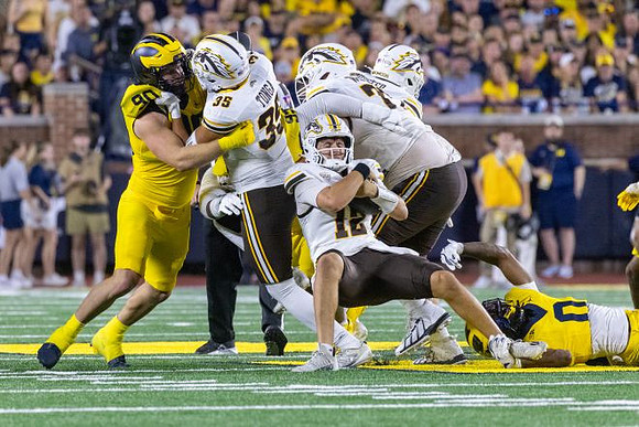 John Henry Daley (90) and Jyaire Hill (0)