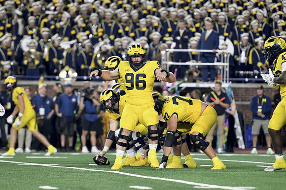 Manuel Beigel (96), Blake Frazier (77), and Jalen Hoffman (42)