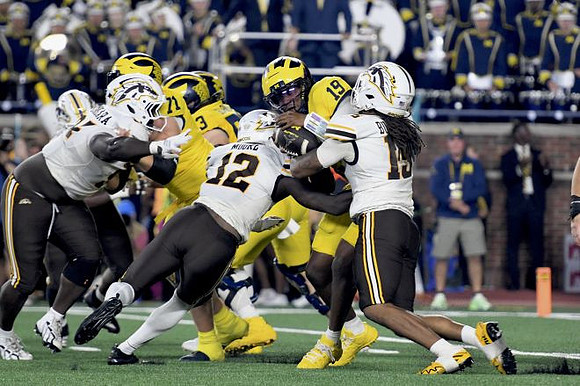 Evan Link (71), Jake Guarnera (53), and Bryce Underwood (19)