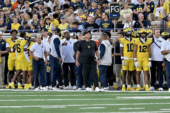 Kyle Whittingham and Michigan Team
