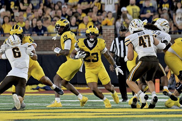 Eli Owens (44), Bryce Underwood (19), and Jordan Marshall (23)