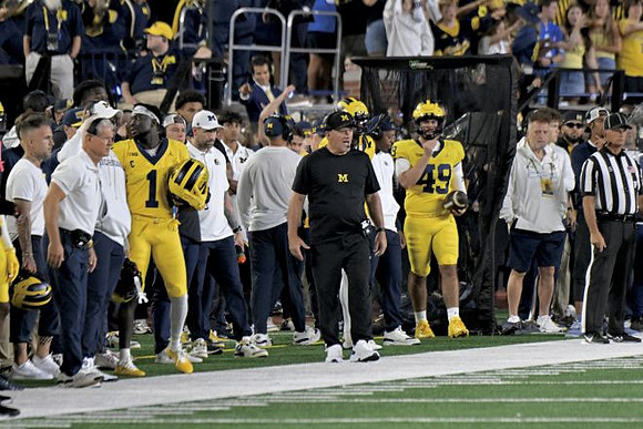 Kyle Whittingham and Michigan Team