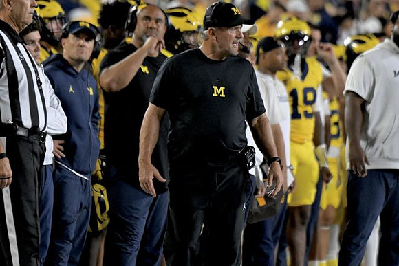 Kyle Whittingham and Michigan Team