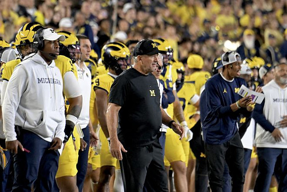 Kyle Whittingham and Michigan Team