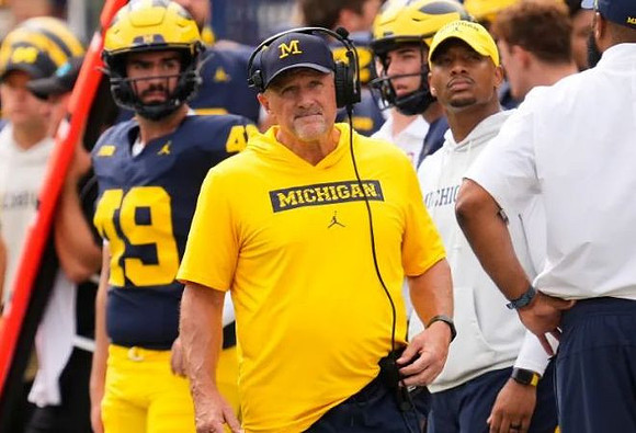 Adam Bazzi (49) and Kyle Whittingham
