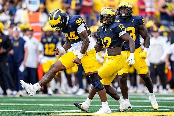 Nate Marshall (94), Nathaniel Owusu-Boateng (12), and Benny Patterson III (93)