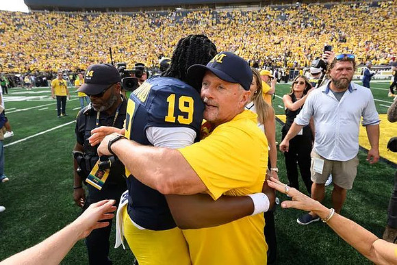Bryce Underwood (19) and Kyle Whittingham