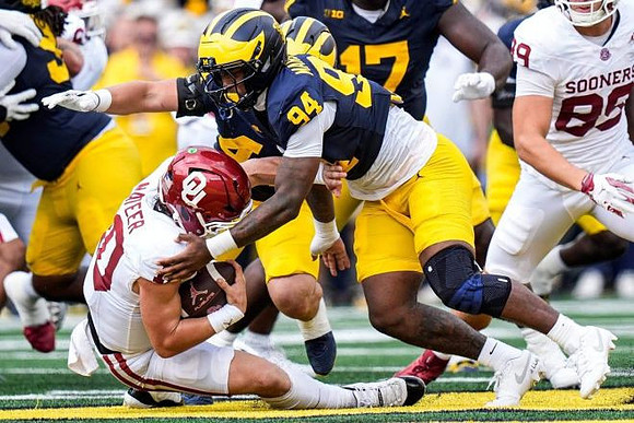 Nate Marshall (94) and Enow Etta (17)
