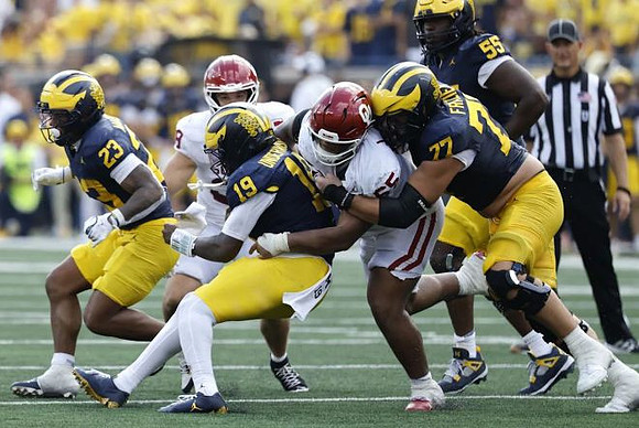 Jordan Marshall (23), Bryce Underwood (19), Blake Frazier (77), and Nathan Efobi (55)