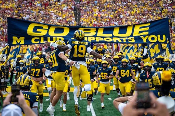 Bryce Underwood (19) and Michigan Team