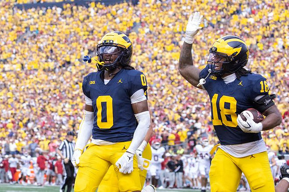 Jyaire Hill (0) and Troy Bowles (18)
