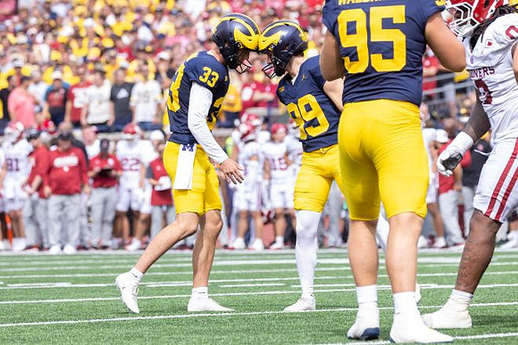Cam Brown (33), Trey Butkowski (99), and Marky Walbridge (95)