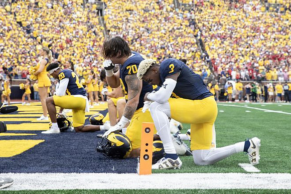 Jaylen Pile (20), Brady Norton (70), and Andrew Marsh (3)