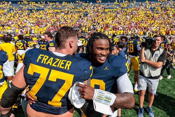 Blake Frazier (77) and Bryce Underwood (19)