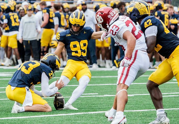Cam Brown (33), Trey Butkowski (99), and Jalen Hoffman (42)