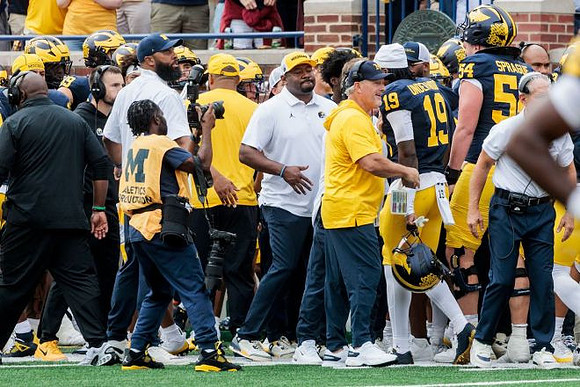 Kyle Whittingham and Michigan Team