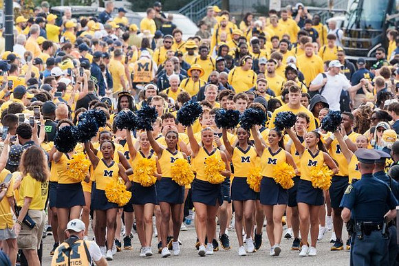 Michigan Cheerleaders and Michigan Team