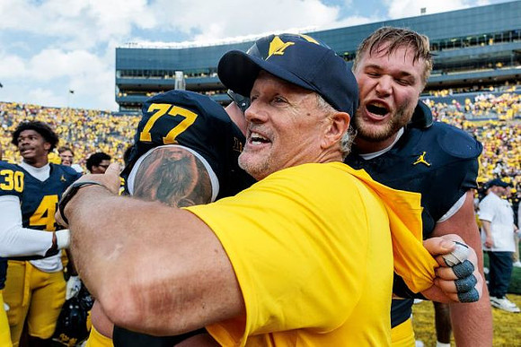 Blake Frazier (77) and Kyle Whittingham