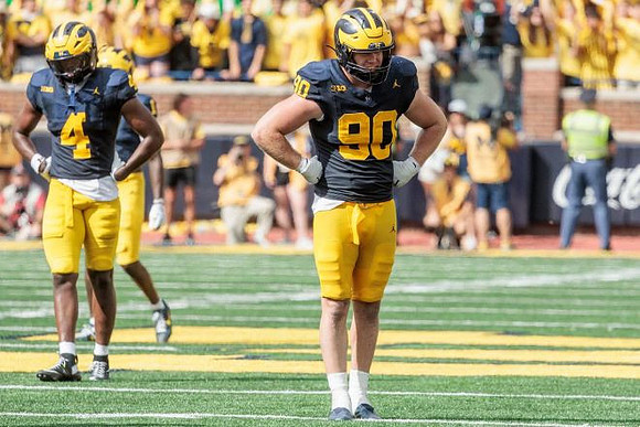 Chase Taylor (4) and John Henry Daley (90)