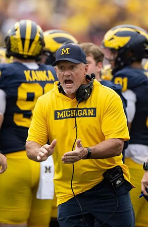 Kyle Whittingham and Michigan Team