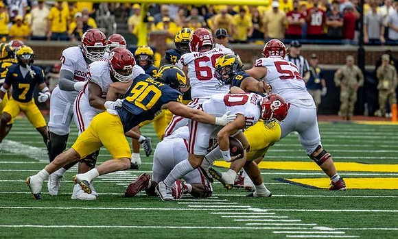 Chris Bracy (7), John Henry Daley (90), Dom Nichols (8), and Enow Etta (17)