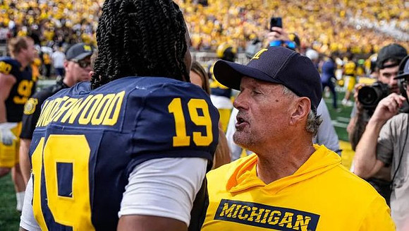 Bryce Underwood (19) and Kyle Whittingham