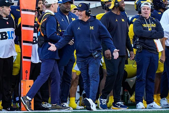 Kyle Whittingham and Michigan Team