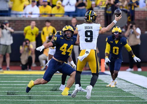Nathaniel Staehling (44) and Jyaire Hill (0)