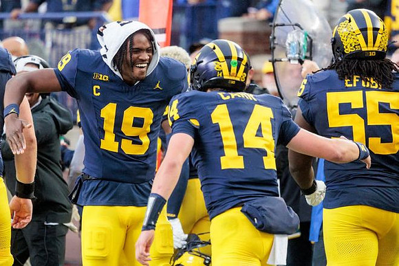 Bryce Underwood (19), Tommy Carr (14), and Nathan Efobi (55)