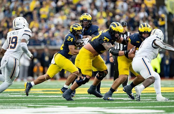 Bryson Kuzdzal (24), Bryce Underwood (19), Blake Frazier (77), and Jake Guarnera (53)