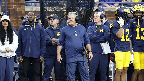 Kyle Whittingham and Michigan Team
