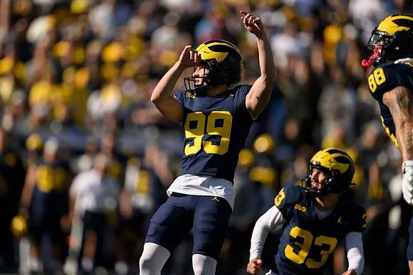 Trey Butkowski (99), Cam Brown (33), and Deakon Tonielli (88)