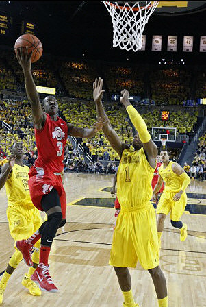 Caris LeVert (23), Glenn Robinson III (1), and Jordan Morgan (52)