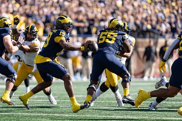 Blake Frazier (77), Bryce Underwood (19), and Nathan Efobi (55)
