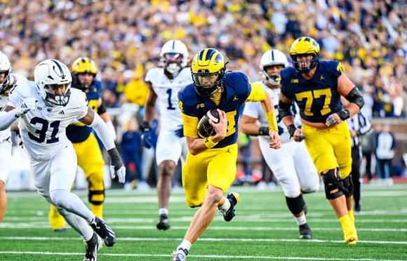 Tommy Carr (14) and Blake Frazier (77)